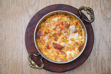 Turkish Menemen omelet in a frying pan. .