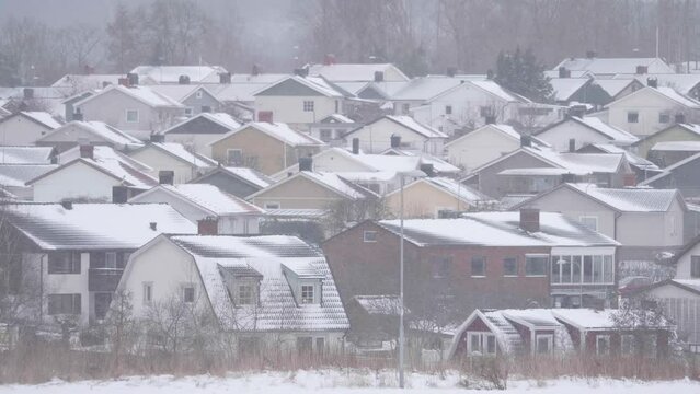 Villa Community Withstanding Heavy Winter Snowfall weather scene, Pan shot