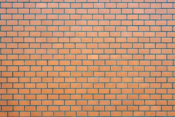 Background from a wall made of orange bricks