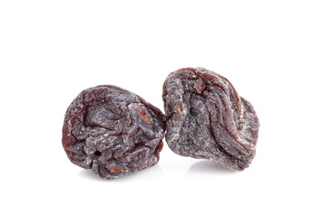 Dried sweet black plums isolated on white background