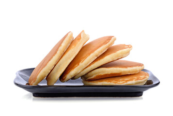 pancakes  on black plate on white background