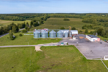 aerial panoramic view on agro-industrial complex with silos and grain drying line