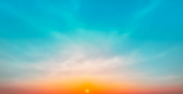 Blur pastels gradient sunset background on soft nature sunrise peaceful morning beach outdoor. heavenly mind view at a resort deck touching sunshine, sky summer clouds.