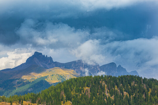 Landscape in the Dolomite Mountains, Italy, in summer, with dramatic storm clouds © Calin Tatu