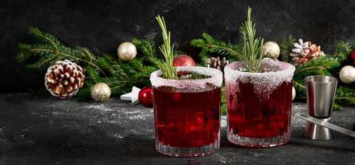 Red christmas cocktail with cranberries in a glasses.
