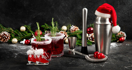 Red christmas cocktail with cranberries in a glasses.