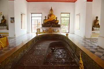 Buddha's footprint inside the Mandapa of Prasat Nakhon Luang Archaeological Site is an old castle that is more than 400 years old for worship. Located at Pra Nakhon Sri Ayutthaya province in Thailand.