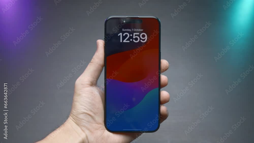 Poster close-up of phone screen with time. action. stylish phone lock screen saver. man holds stylish phone