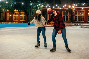 Couple skating during winter season