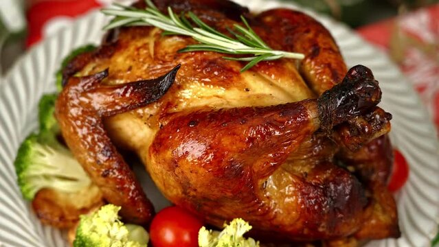 Place plates and grilled chicken on the Christmas table