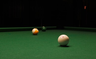 Vibrant image of two snooker balls placed on the green felt of a snooker table