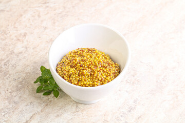 Grain mustard sauce in the bowl