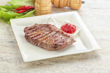 Grilled rib-eye steak beef meat