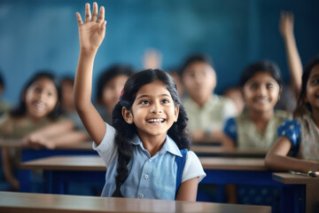 Cute indian little girl hands up for answering to question in class - obrazy, fototapety, plakaty