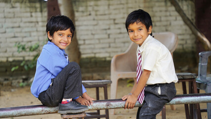 Cheerful Happy smiling village school kids in uniform standing. Concept of friendship, education...