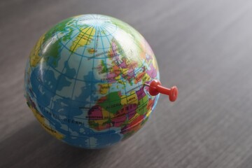 Close up image of push pin pointing at Gaza, Palestine on world globe. Copy space for text