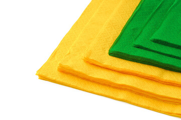 Green and yellow paper napkins on white background