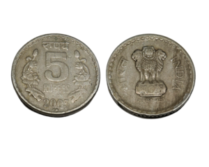 five rupees coin Indian old coin. on a white background. Rupees, Indian Currency coins money, business real estate concept.