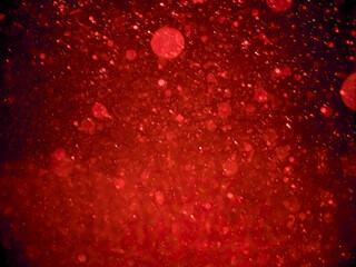 Abstract background, blurry, bokeh, raindrops, red background.