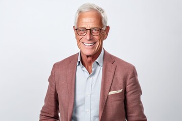 Portrait of happy senior man in eyeglasses smiling at camera - Powered by Adobe