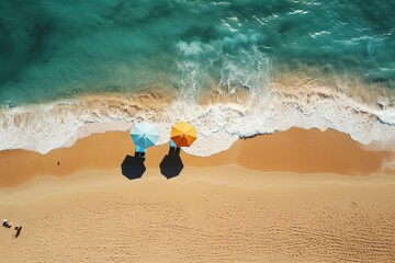 Two sunbeds on an empty beautiful beach. Blue sea with waves. Beach holiday concept. - obrazy, fototapety, plakaty