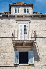 Fototapeta na wymiar Beautiful facade of an old stone house on the promenade in Orebic, Croatia