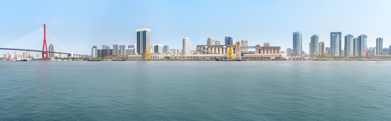 Fototapeta premium financial district buildings of shanghai and the yacht docked at the dock