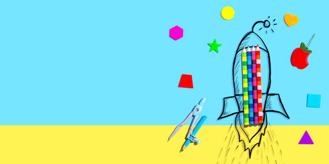 Back to school theme with a rocket with school supplies - Flat lay