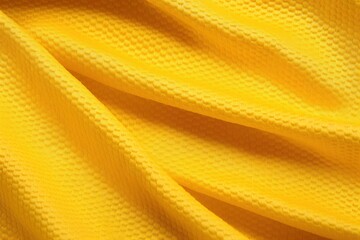 Yellow color football jersey clothing fabric texture sports wear background, close up.