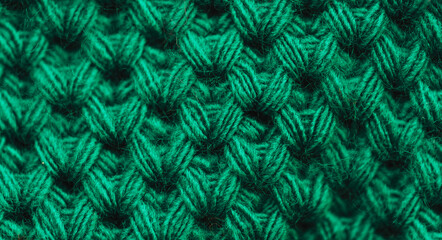 Background of striped knitted sweater in green color.