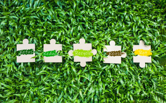 Recycle, reuse, reduce, reject, repair and rot. Improvement concept for higher or similar quality, letters and jigsaw puzzles placed on the grass