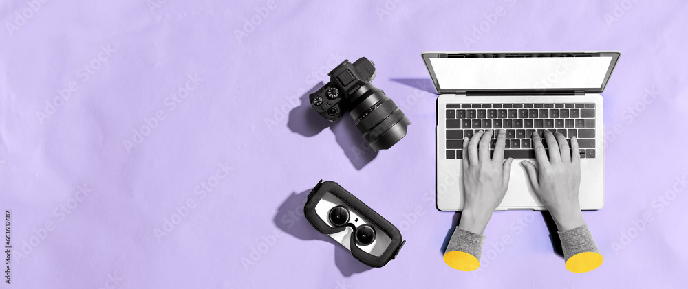 Poster laptop computer with a slr camera and vr from above
