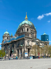 The Berlin Cathedral or Berliner Dom and statues on Schloss Bridge in Berlin