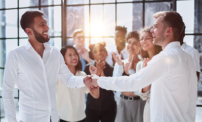 close up. successful business people shaking hands