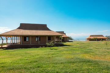 Cabins at a campsite at Lake Jipe at Kenya Tanzania border seen from Tsavo West National Park, Kenya