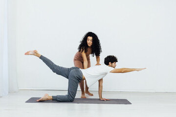 Man and woman doing yoga exercises meditation asana lotus pose