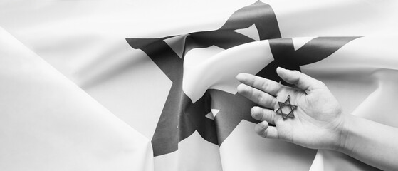 Hand with star of David on flag of Israel