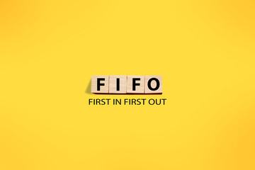FIFO first in out, text words typography written on wooden letter, life and business motivational...