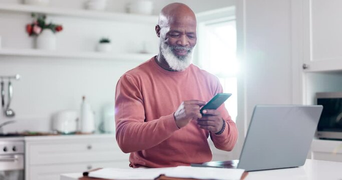 Phone, laptop and budget with a senior black man in the kitchen of his home for finance planning. Mobile, computer and investment with an elderly person reading information for retirement savings