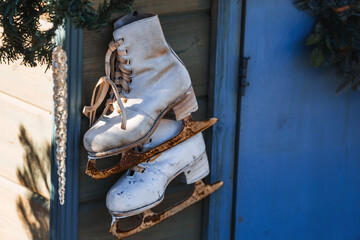 Beautiful holiday decorations. Rusty figure skating skates. Beautiful Christmas background. The...