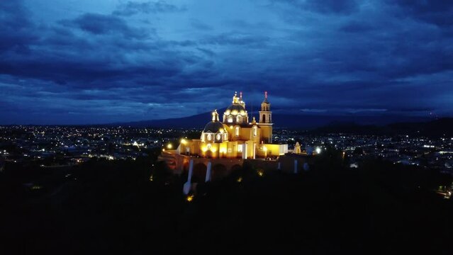 Church Cholula Puebla Mexico Night iglesia Santuario de la Virgen de los Remedios on Pyramid drone View night day Timelapse Cempasuchil Fields