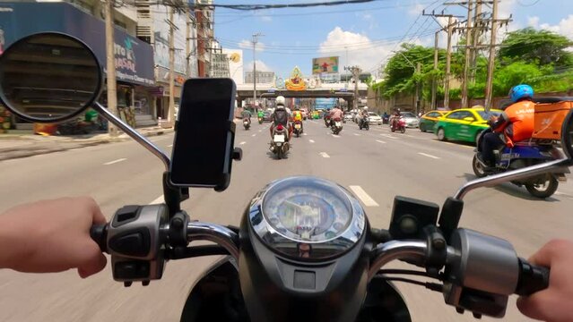 Hyperlapse of motorcycle riding in road traffic in Bangkok, Thailand. POV