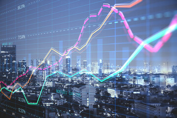 Abstract creative business graph with index and grid on blurry city background with skyscrapers. Stock market and financial statistics concept. Double exposure.