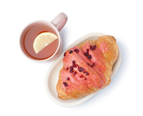 Bowl with tasty sweet croissant and cup of tea isolated on white background