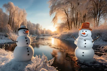 Keuken spatwand met foto snowman in the snow frozen tree and river in background. © candyhalls