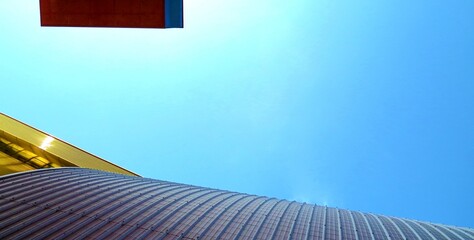 building with blue sky and clouds