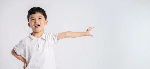 Portrait of asian boy posing on white background - obrazy, fototapety, plakaty