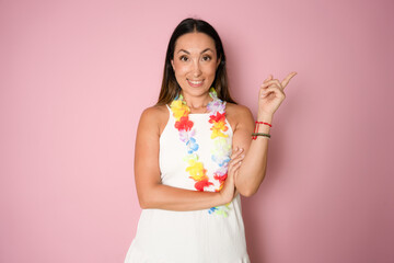 Photo of cheerful satisfied brown long hair lady wear white dress and hawaiian necklace showing v-sign hello peace symbol isolated on pink color background