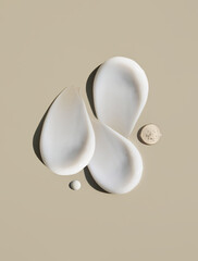 cosmetic smears of creamy texture on a beige background