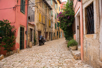 A quiet back street in the historic centre of the medieval coastal town of Rovinj in Istria, Croatia - obrazy, fototapety, plakaty